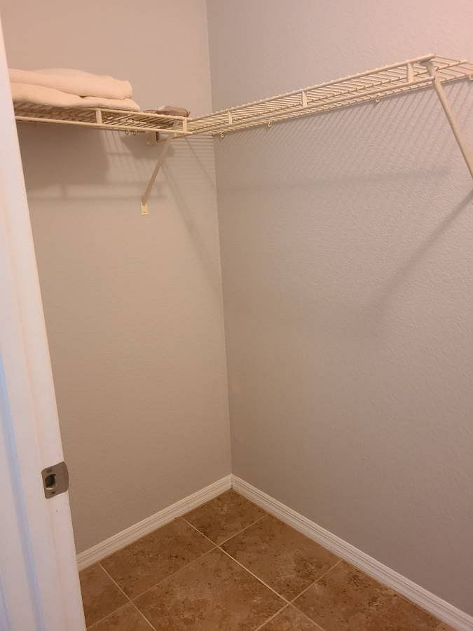 Large walk-in closet. Shoe rack & hangers included.