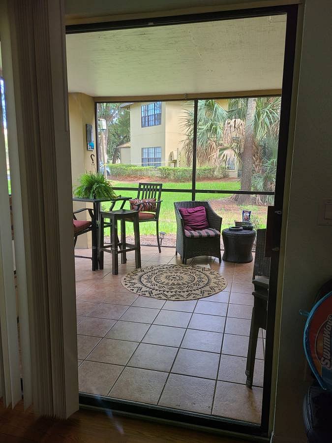 Largest Lanai space! with outdoor TV and ceiling fan.
