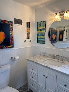 Shared bathroom - marble top vanity