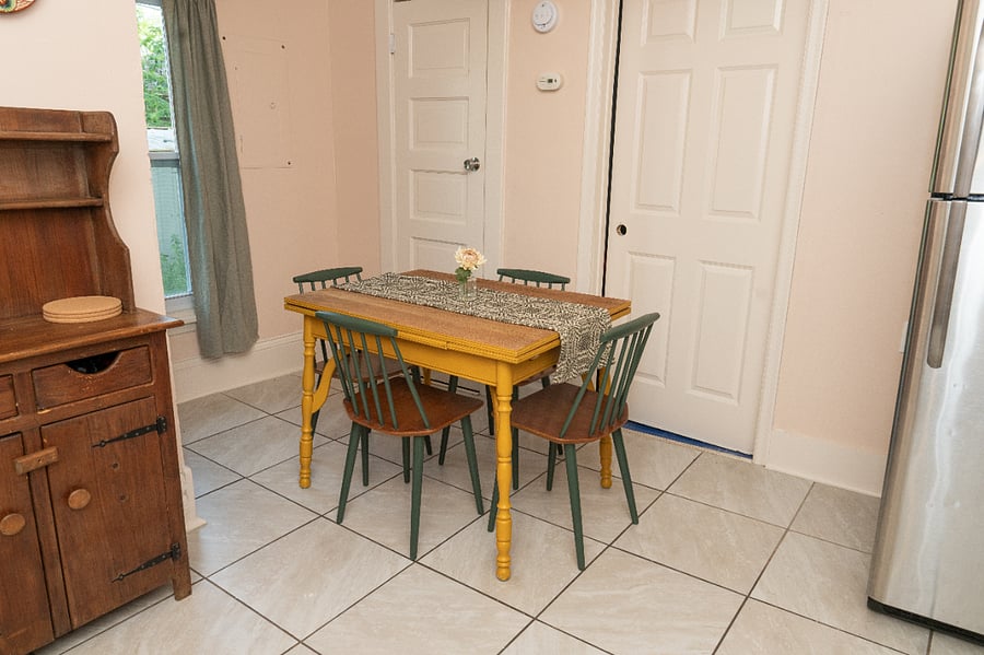 A small dining area in the kitchen. The has two extendable sides giving a couple extra place settings, if needed. 