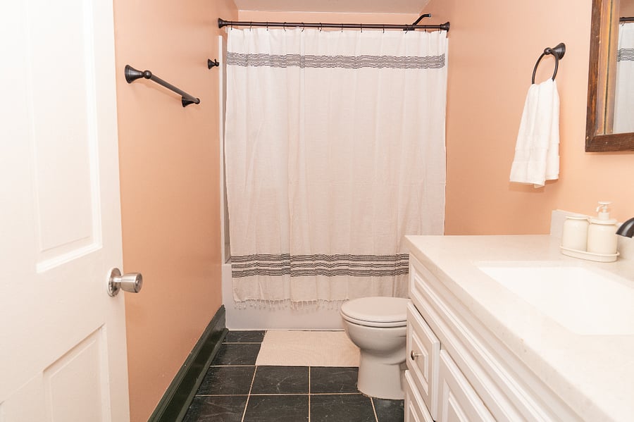 The newly updated bathroom features a brand new shower/tub combo. 