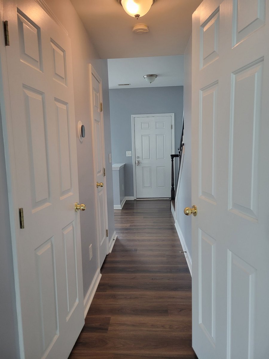 1/2 BA and hall closet on the left; Laundry on the right. Stairway at the end on the right