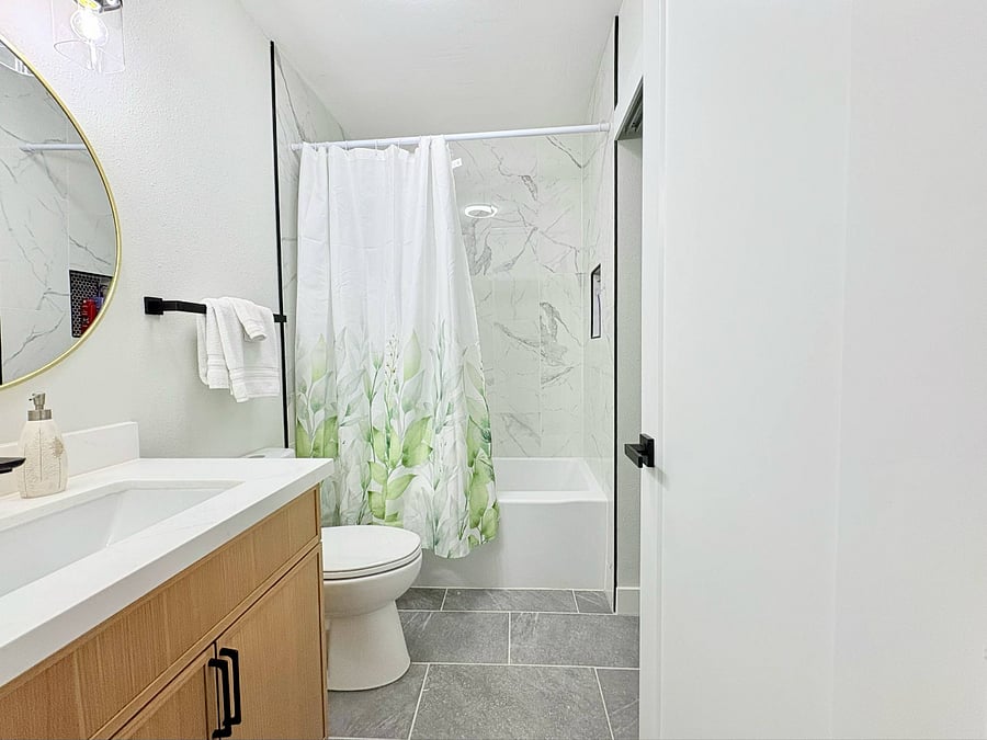modern updated bathroom with contemporary fixtures an, offering a fresh and luxurious experience