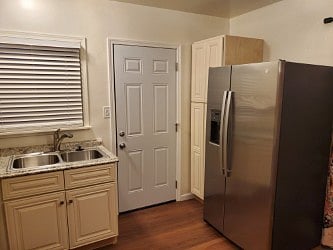 Custom Kitchen includes New GE Side/Side Refrigerator w/ Freezer & Icemaker/Water Dispenser.
Side Pantry for groceries & misc items.
Rear door to back yard.