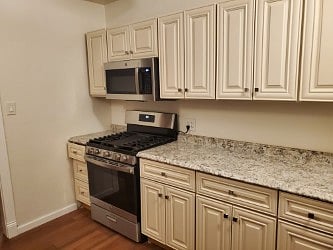 Custom Full kitchen.
Includes GE Gas Range/Oven, OTC Microwave w/ Exterior Grill.
