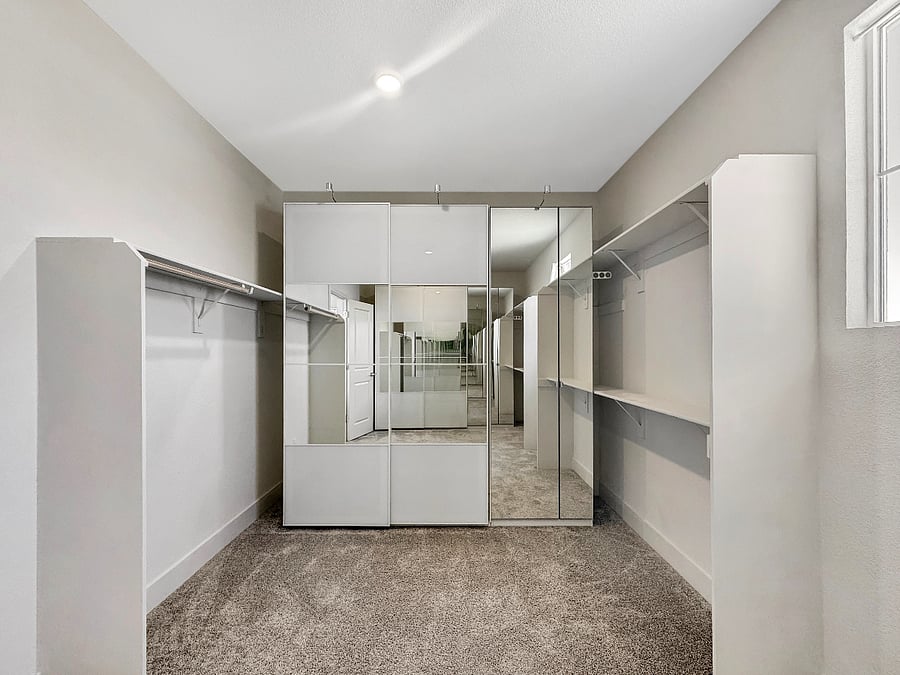 Huge ensuite walk-in closet with luxury IKEA system