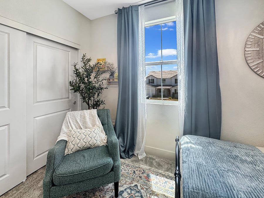 "Blue Room" sleeps two in twin beds. Features a comfy sofa chair and gorgeous chandelier ceiling fan.