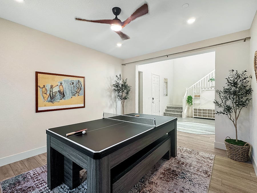 Entertainment room with convertible Pool/Ping-pong table and record player.