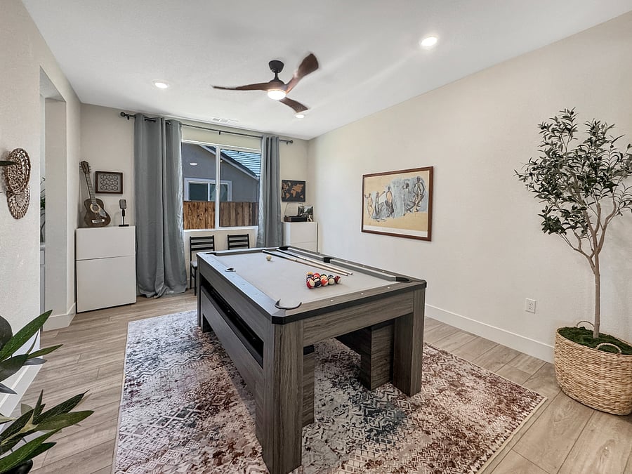 Entertainment room with convertible Pool/Ping-pong table and record player.