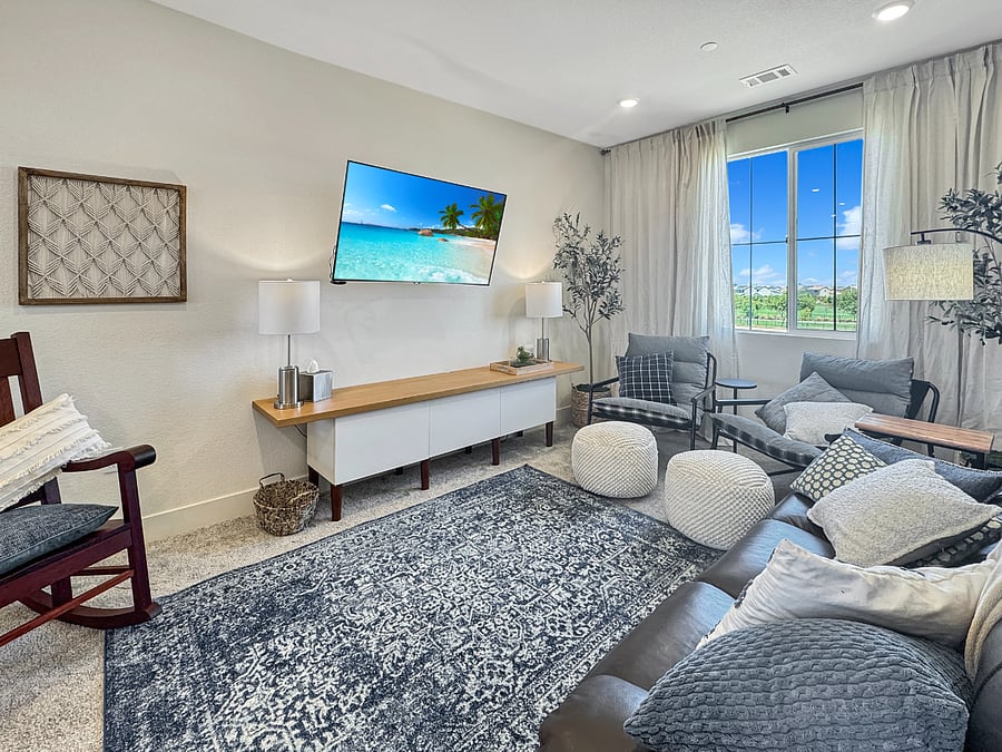 Cozy loft with smart tv, leather recliner, custom rocking chair, comfy side chairs, and task table and chair. Featuring a great view of the park!