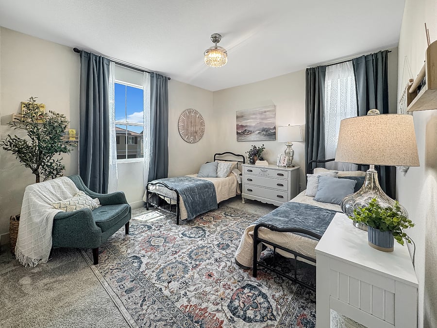 "Blue Room" sleeps two in twin beds. Features a comfy sofa chair and gorgeous chandelier ceiling fan.