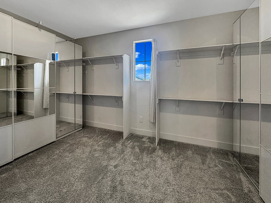 Huge ensuite walk-in closet with luxury IKEA system