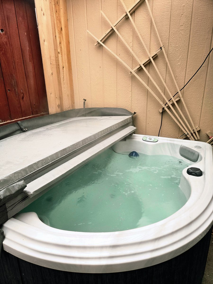 Relaxing private hot tub located right in the backyard
