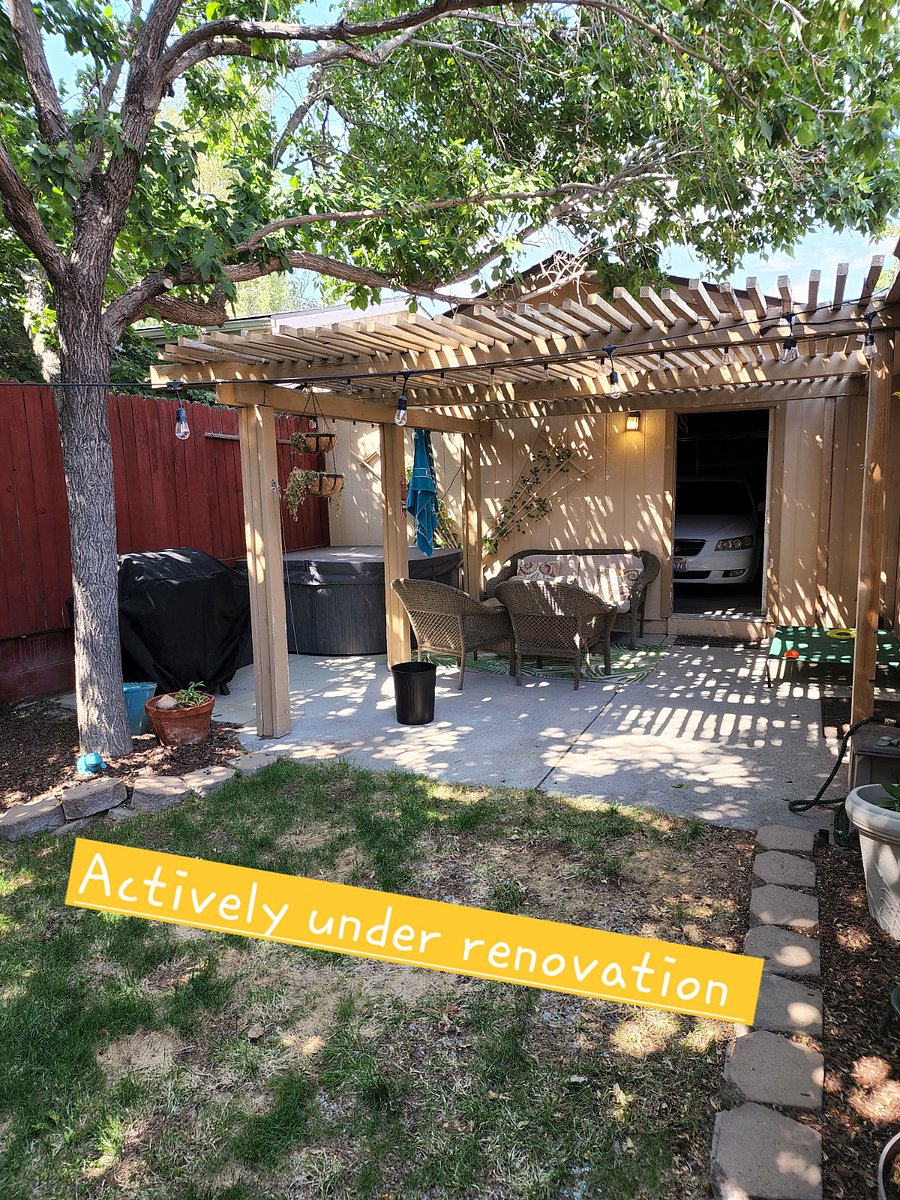 Relaxing and shaded backyard patio with private hot tub and BBQ