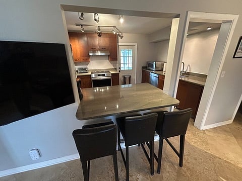 Kitchen bar area with three stools