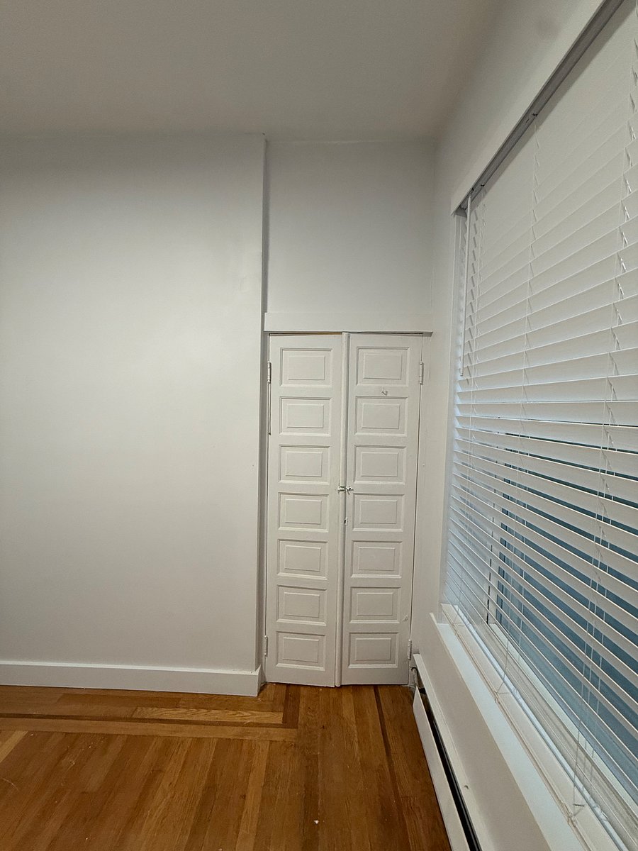 Inside of the closet has plenty of storage and two poles to hang up clothes and pants.