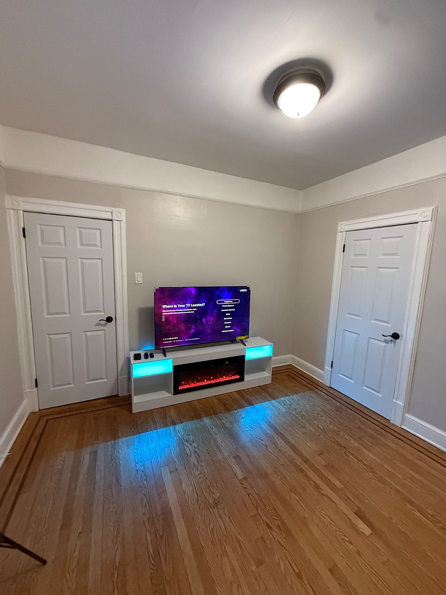 Living room with fireplace and 55 inch smart TV