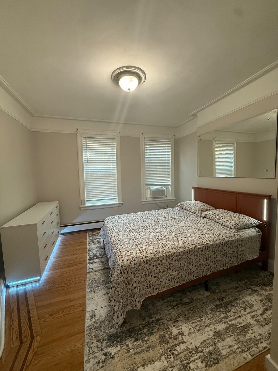 Master bedroom with queen size bed, 12 drawer dresser with LED lights and Bluetooth and charge station, large closet with shoe rack and ample amount of hanging space for your clothing.