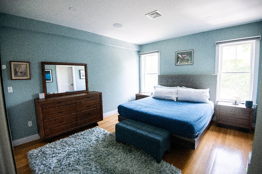 The primary suite has ample storage and an adjustable bed - automatic black-out shades allow for a restful night, just say "Siri, close shades!"