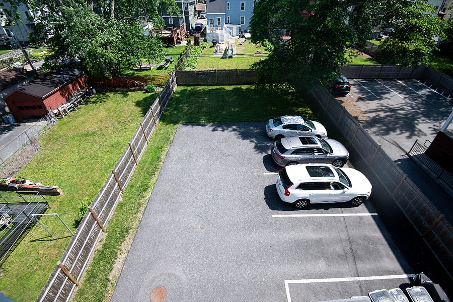 Dedicated off-street parking. Last spot, next to the grass.