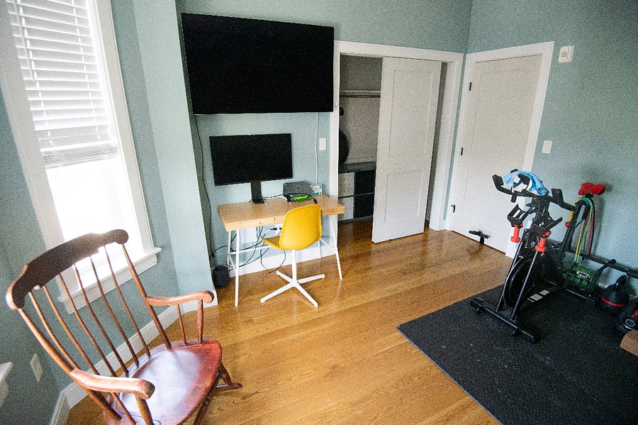The second bedroom has fitness equipment and a small home office setup, making it truly multipurpose.