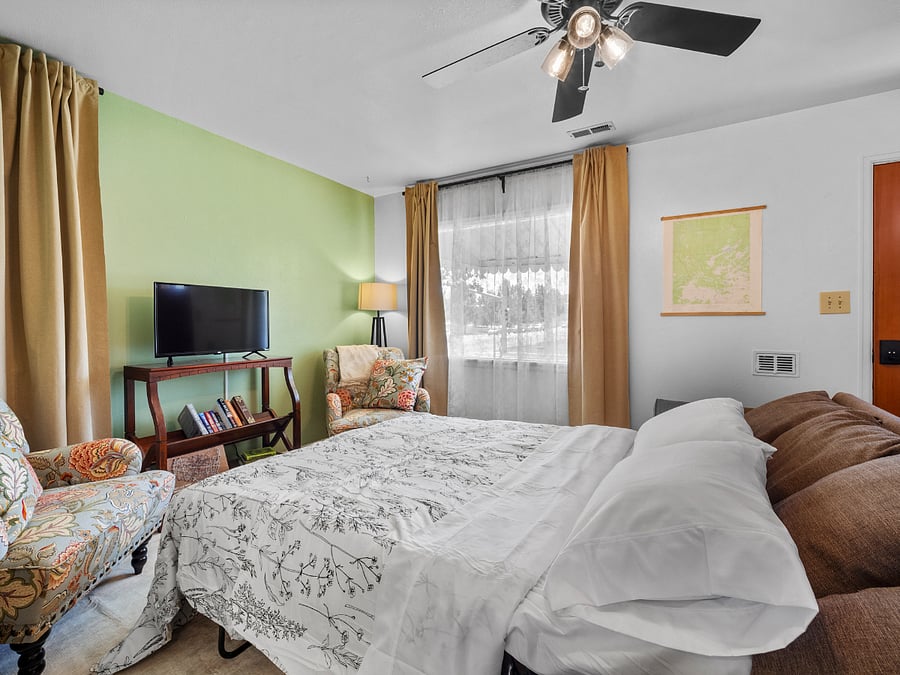 The living room includes a couch bed that can accommodate an extra child or temporary house guest.