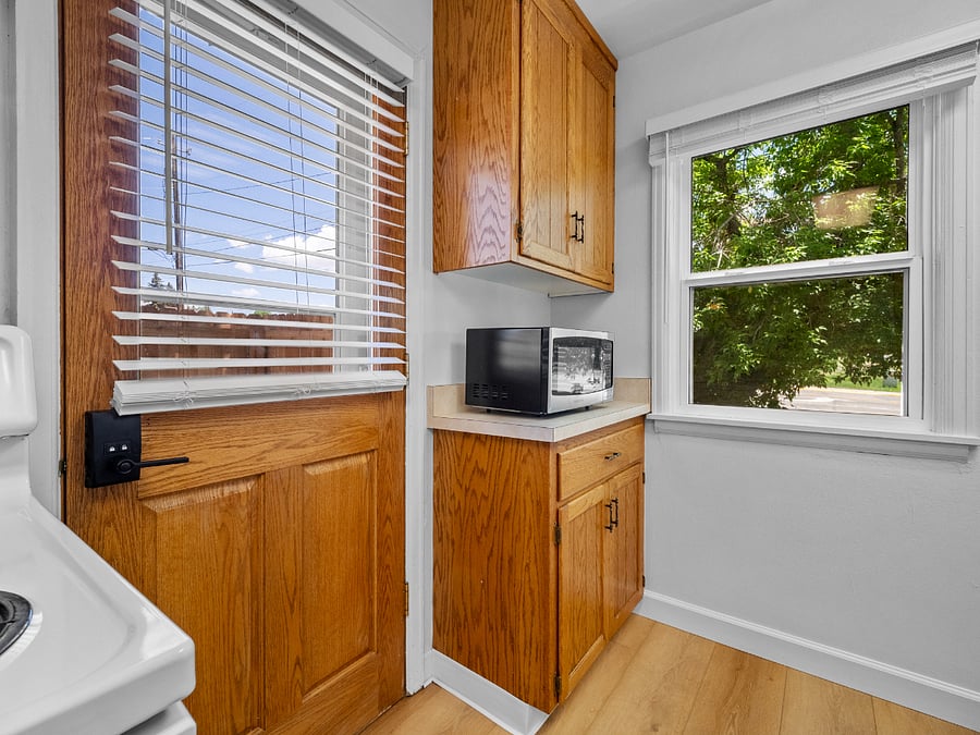The kitchen includes a microwave, blender, and toaster along with full-sized appliances.