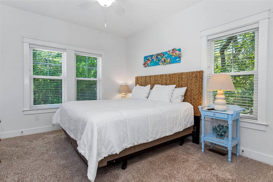 Primary bedroom with king and private access to screened porch