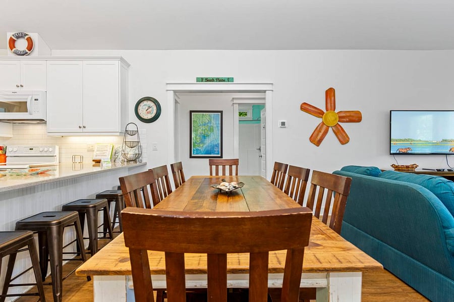 Dining area includes table that seats 8 plus bar seating
