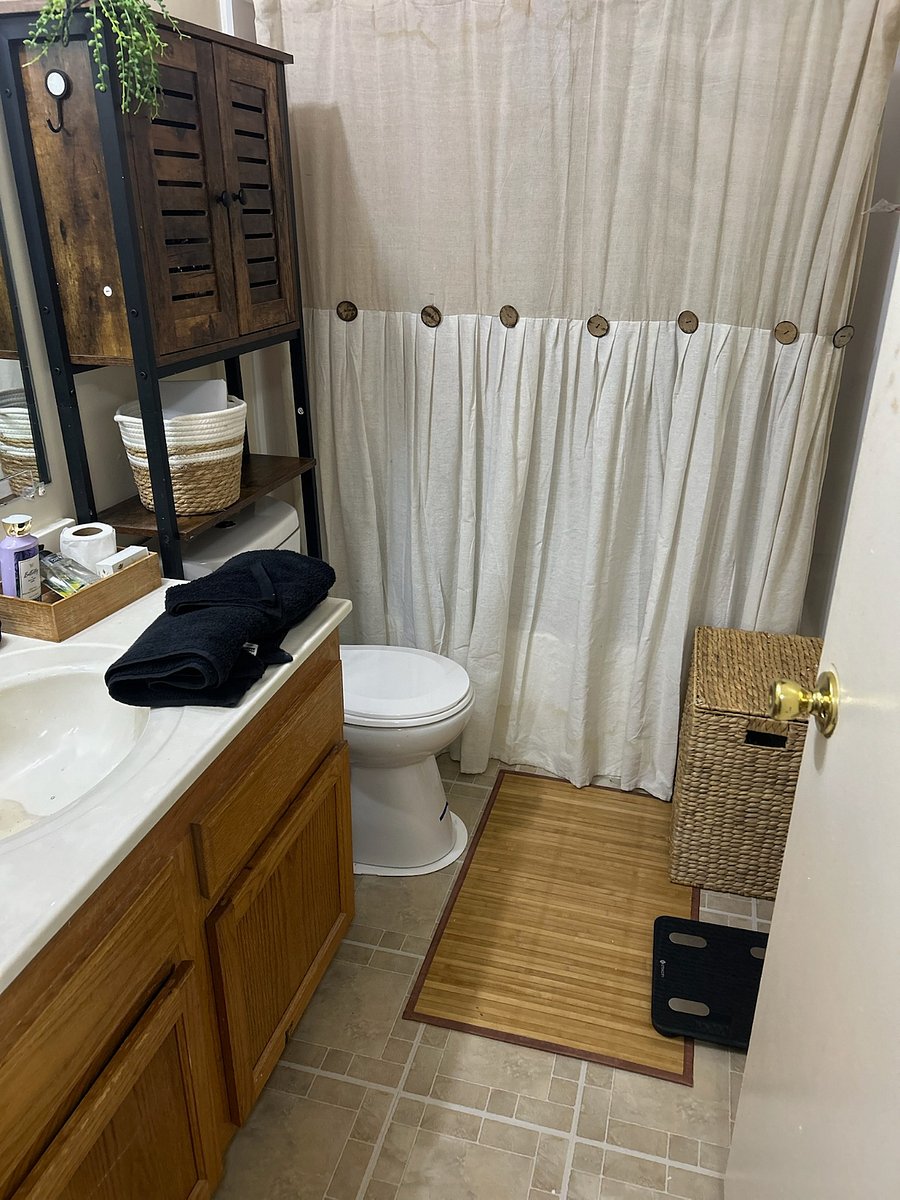 Private bathroom, tub and shower combo, cabinet and private linen closet