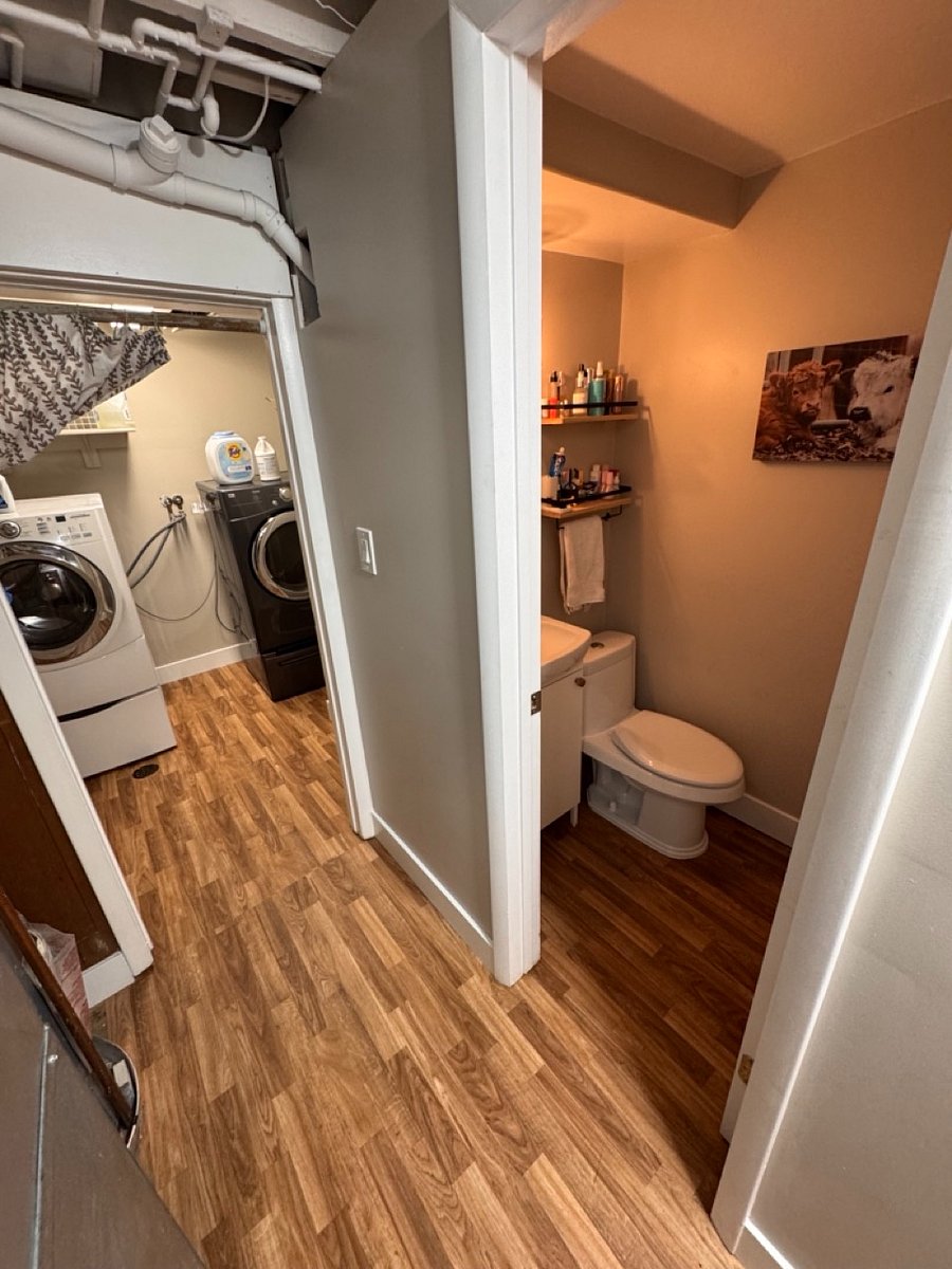 Part of the basement bathroom, and peek at the laundry room
