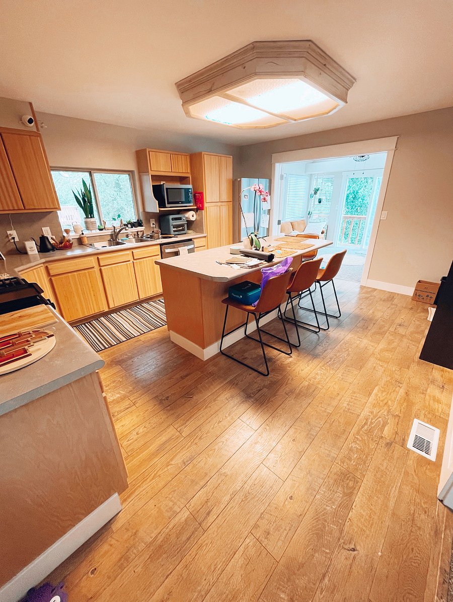 Another view of the kitchen attached to a gorgeous sun room