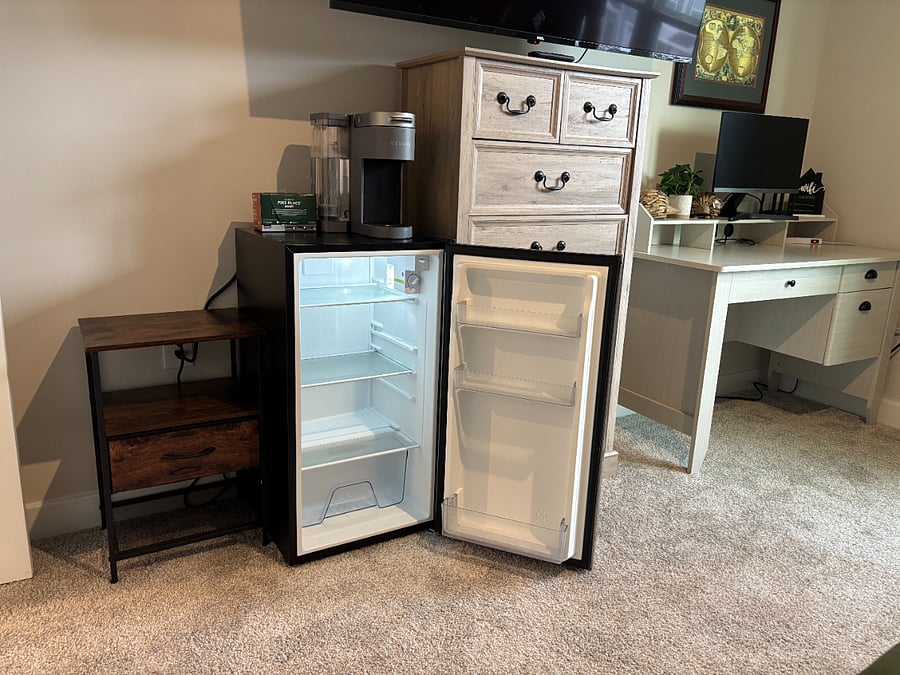 Beyond the fridge downstairs, we are providing a mini fridge in the room along with a coffee machine. 
