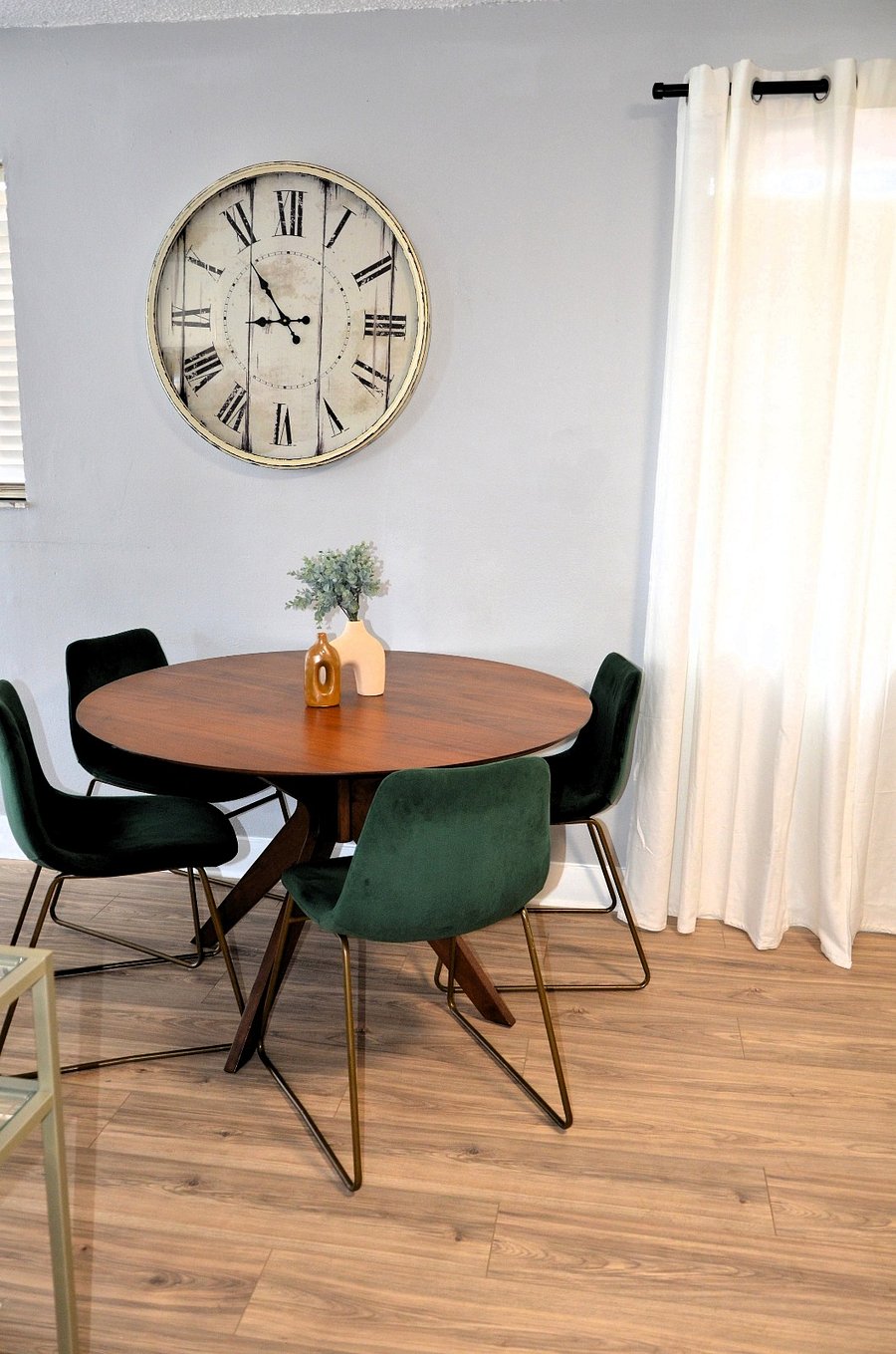 Gather in this modern dining space with soft, plush seating after a long workday to enjoy a meal.
