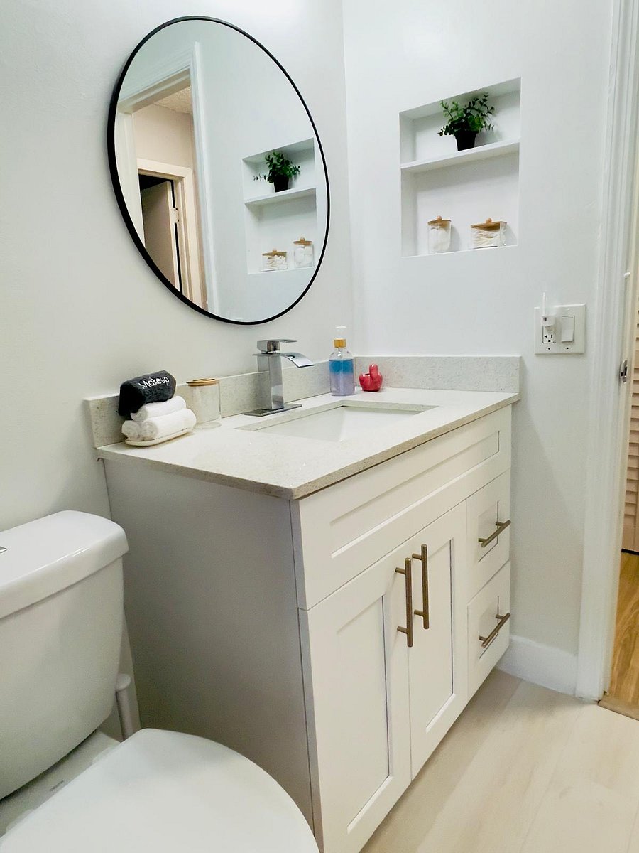 Enjoy a sleek and modern vanity space with ample lighting, under-sink storage, and personal touches to make you feel pampered.