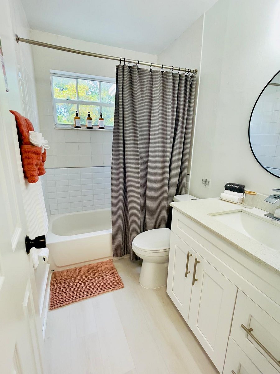 Updated and refreshed bathroom featuring a tub/shower combo, a window that opens to let in natural sounds or light from the lively Miami area, and complimentary toiletries for your stay.