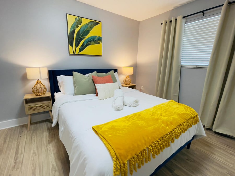 Rest easy in this bold yet serene suite featuring rich Caribbean blues, crisp whites, and modern touches inspired by upscale island stays.