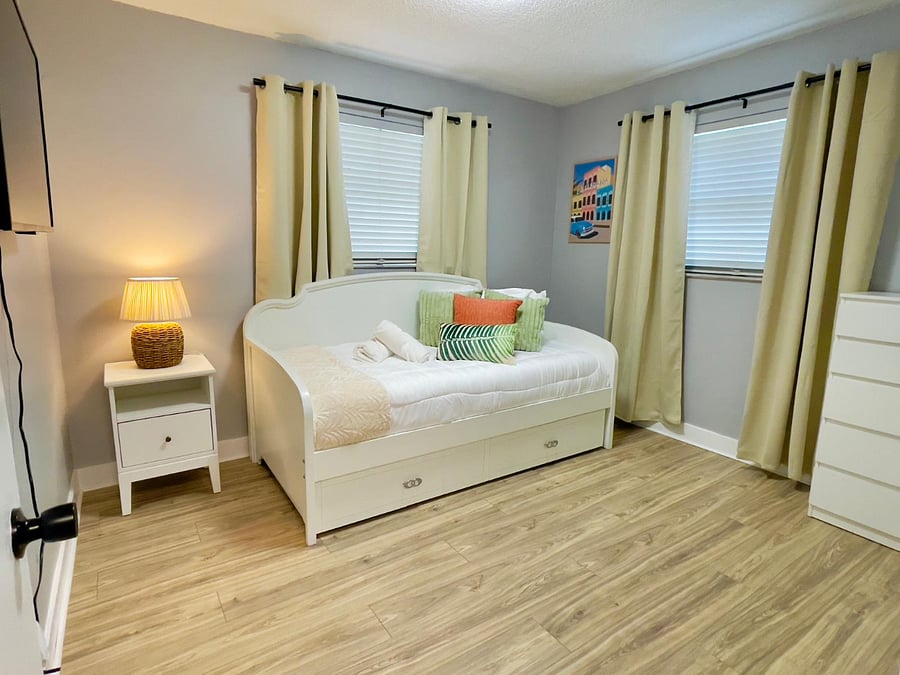This charming twin daybed is the perfect spot to relax and unwind! Plus, it has a handy hidden space underneath for guests, making it both cozy and convenient for everyone.