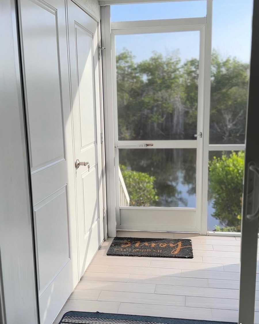 Back door on the lanai, which leads out to the water and a dock.
The closet on the left is storage and full-size washer and dryer.
