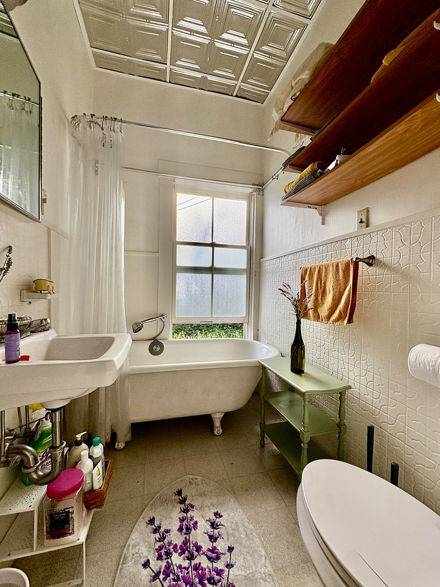 Bathroom with claw foot tub and shower