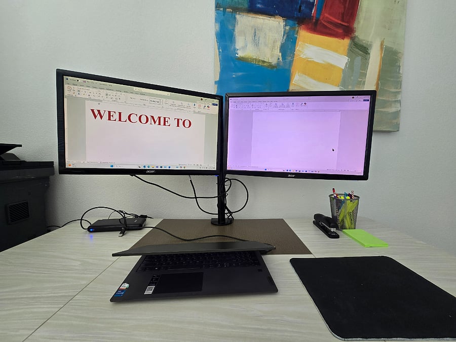 Work station equipped with dual monitors and printer