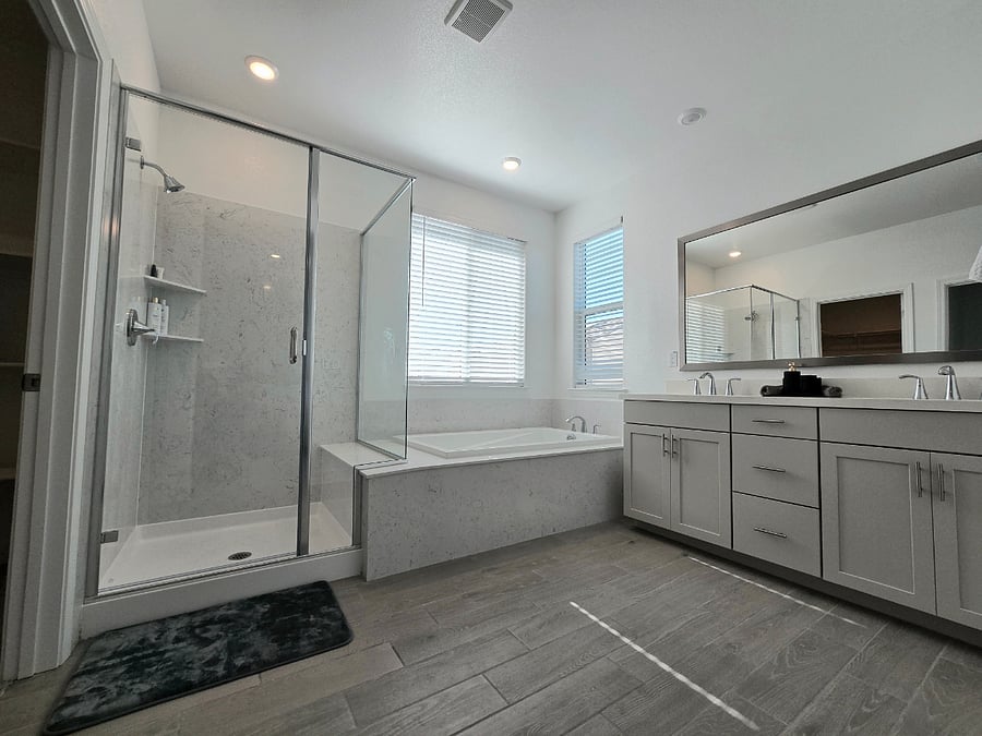 Primary bathroom with walk access to walk-in closet