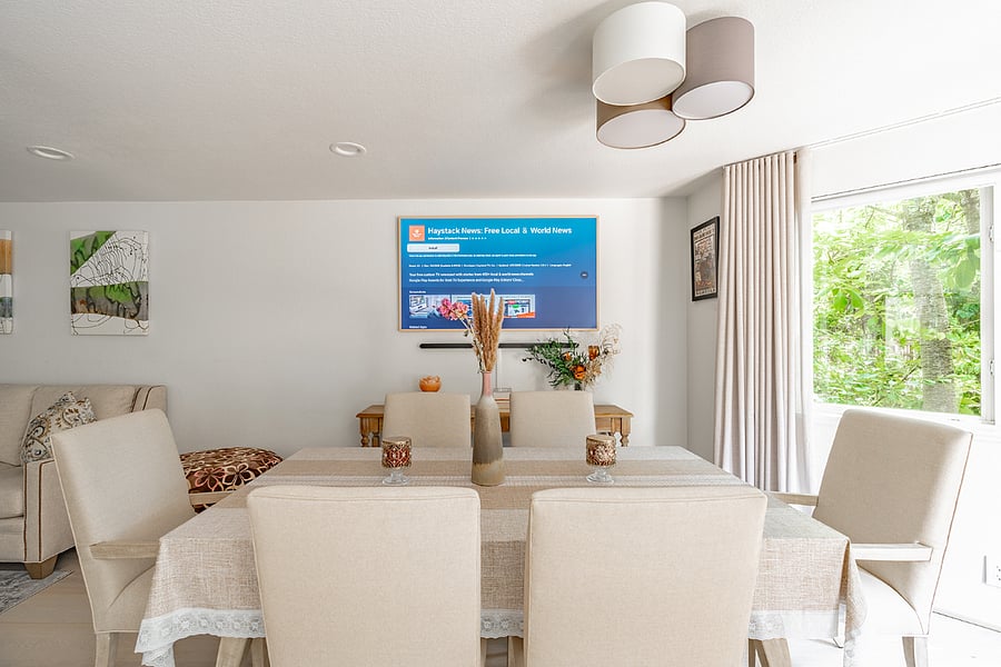 Dining space with high-end dining set and smart TV