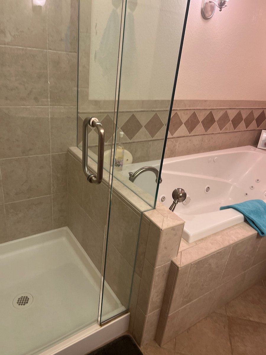 Basement bathroom with sunken jetted tub and shower.