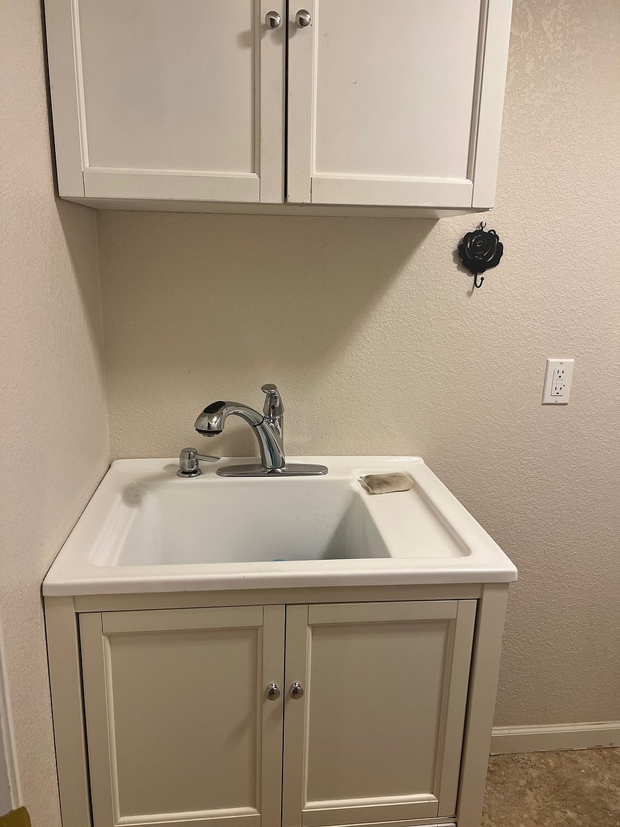 Basement laundry room/kitchen sink.
