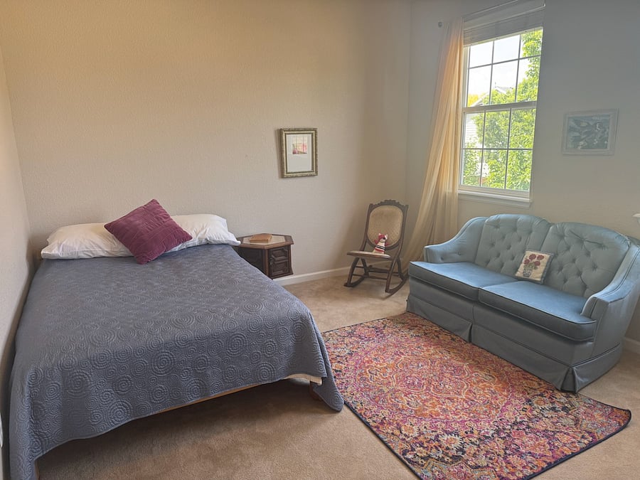 Third bedroom, second floor, has a full-size bed, and sitting area with large closet.