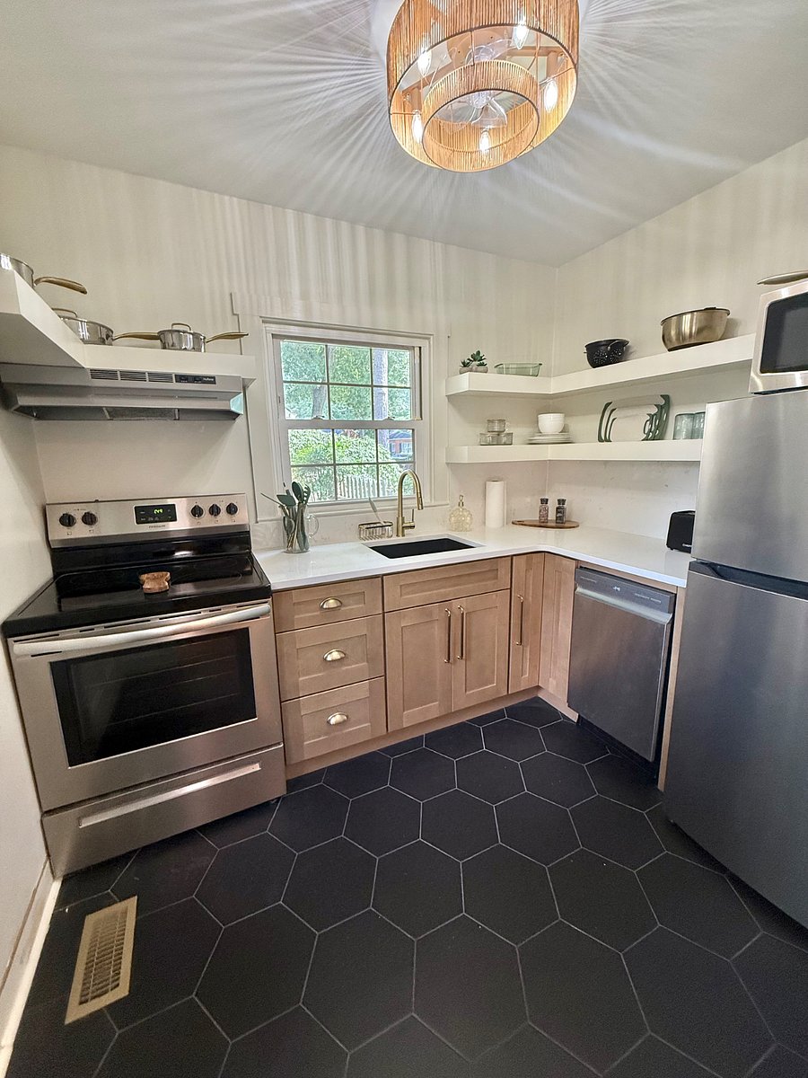 Completely renovated kitchen with all new appliances with granite countertops and backsplash.