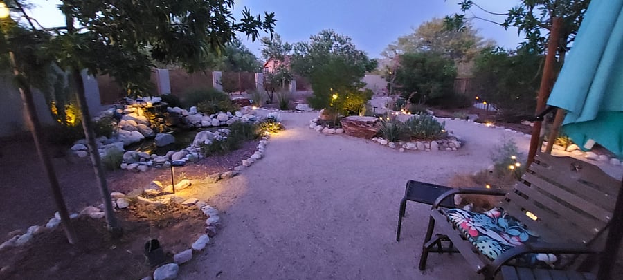 Winding paths in back yard with secluded sitting areas