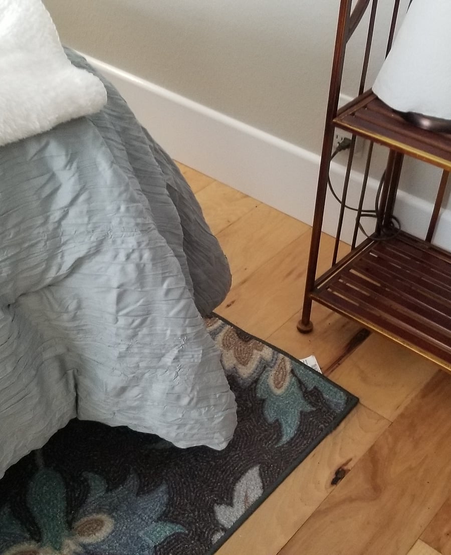 Real Hardwood hickory floors throughout home. Rug under the bed
