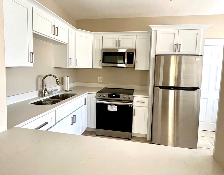 Electric stove, oven, microwave and full size fridge.